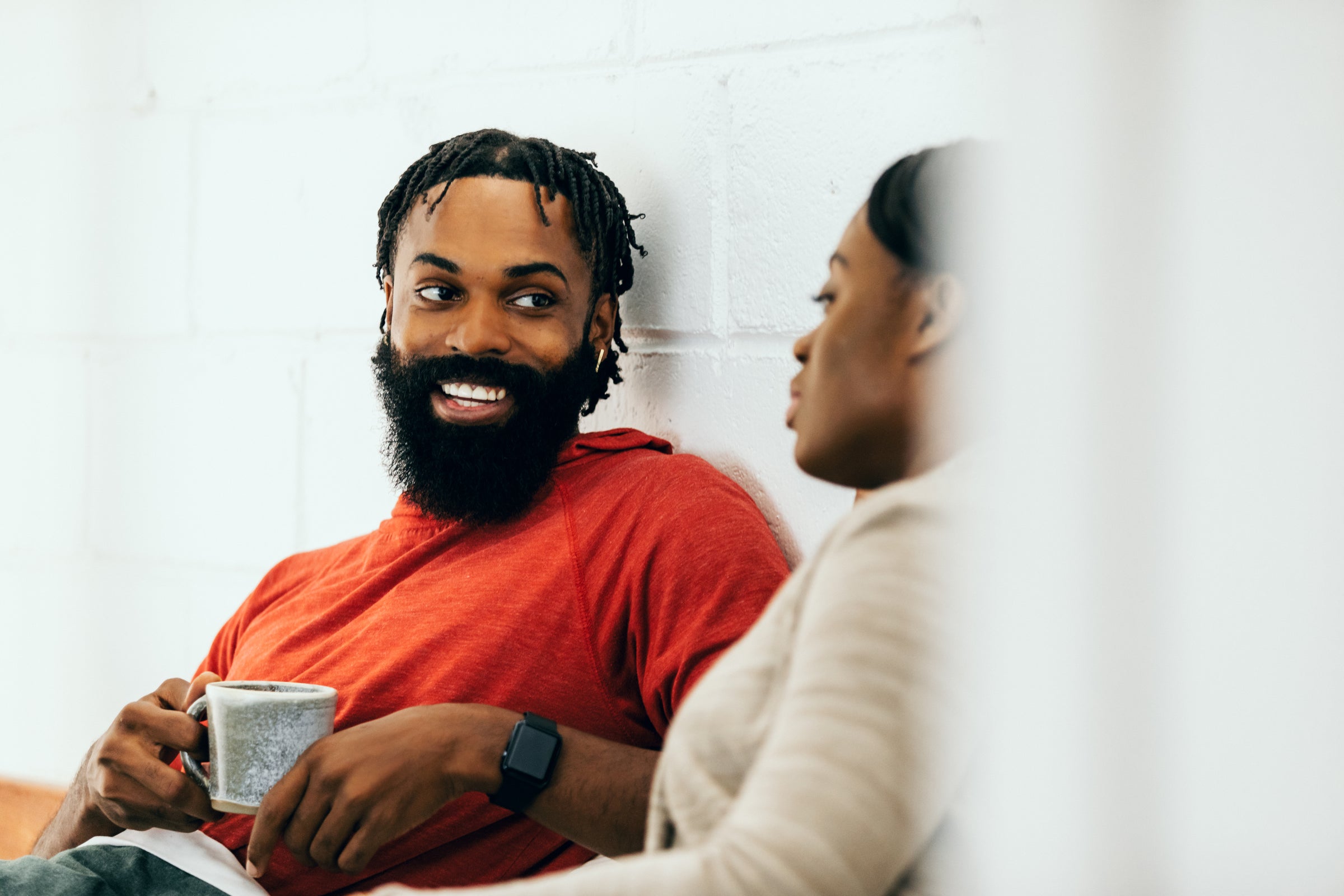Two English learners chatting confidently over coffee